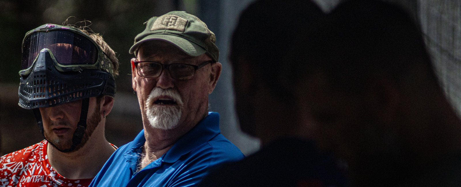 Pete Russell talking with players in the pits between games