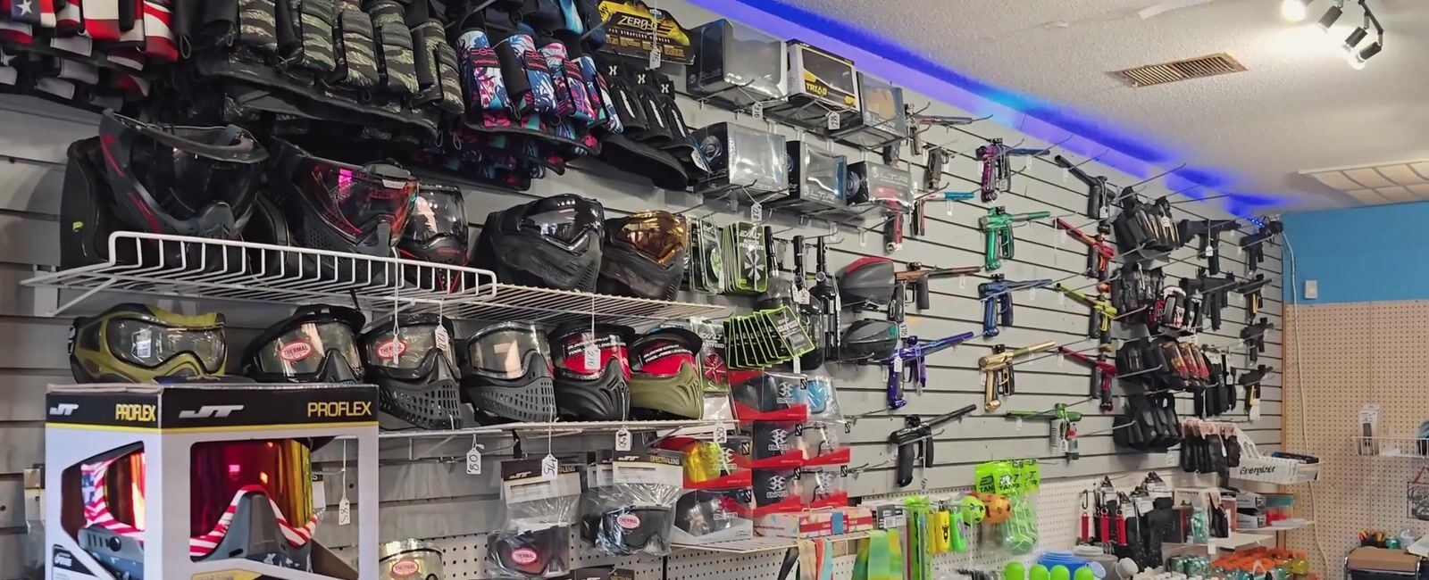The fully stocked Palmetto Hills pro shop wall — markers, masks, and gear